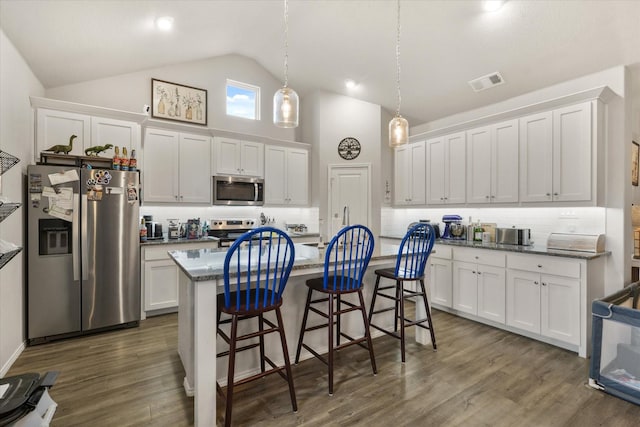 kitchen featuring stainless steel appliances, white cabinets, visible vents, and dark wood finished floors