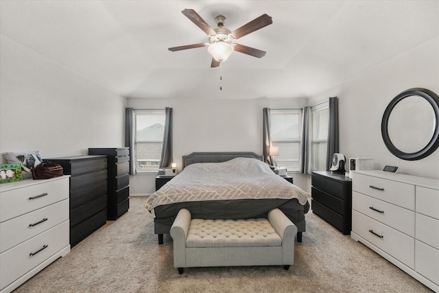 bedroom with light colored carpet and ceiling fan