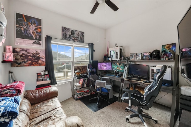 carpeted office space with ceiling fan