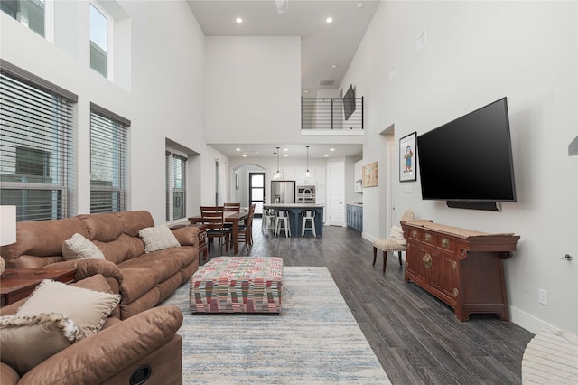 living room with dark hardwood / wood-style floors