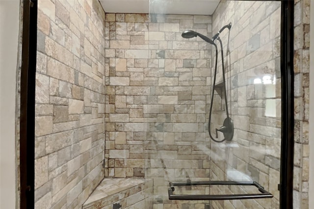 bathroom featuring an enclosed shower