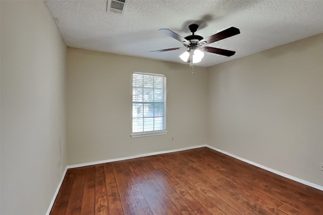 unfurnished room featuring a textured ceiling, wood-type flooring, and ceiling fan