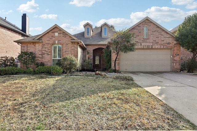 front facade with a garage and a front yard