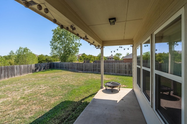 view of yard with a patio area and a fire pit