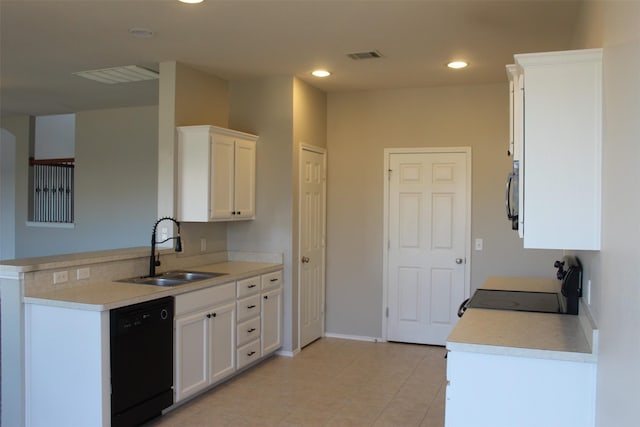 kitchen featuring black dishwasher, sink, white cabinets, range, and kitchen peninsula