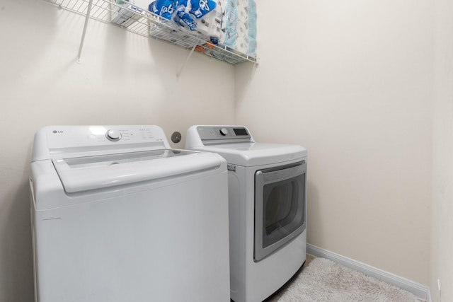 laundry room with independent washer and dryer