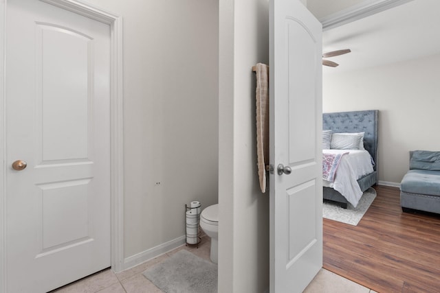 bathroom with ceiling fan, wood-type flooring, and toilet