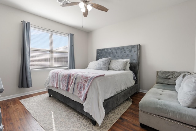 bedroom with dark wood-type flooring and ceiling fan