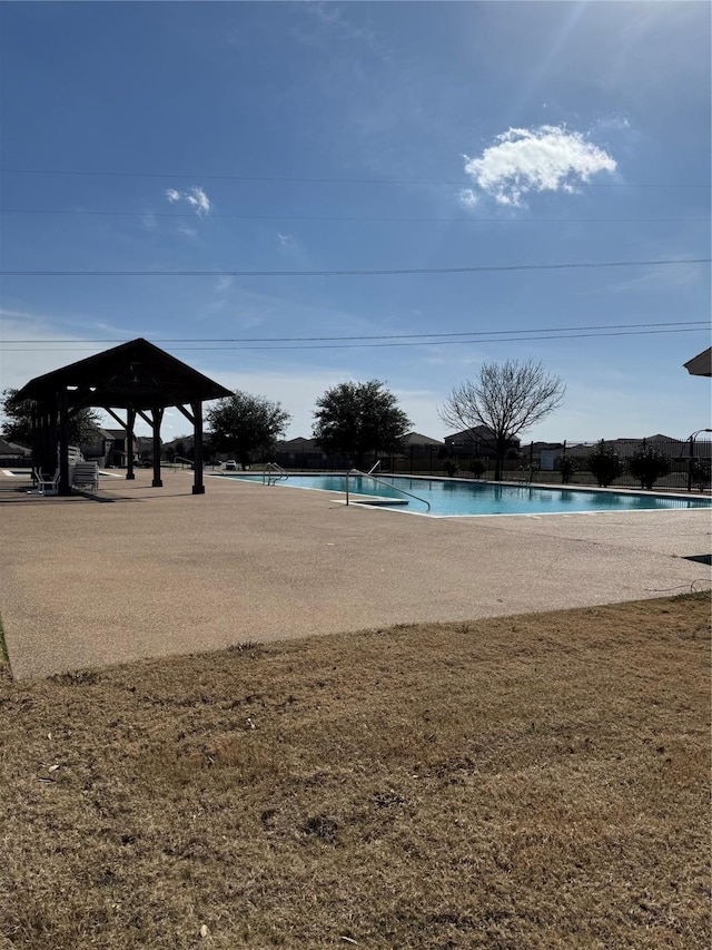 view of pool featuring a gazebo and a lawn