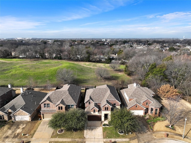 birds eye view of property with a residential view