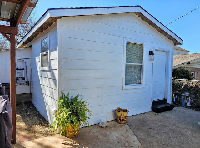 view of side of home featuring a patio