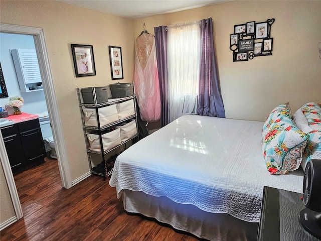 bedroom with dark wood-type flooring