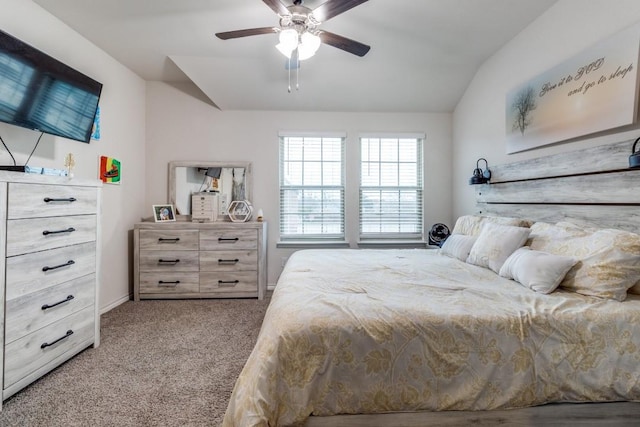 bedroom featuring ceiling fan, lofted ceiling, and light carpet