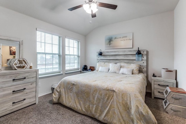 bedroom with vaulted ceiling, ceiling fan, and dark carpet