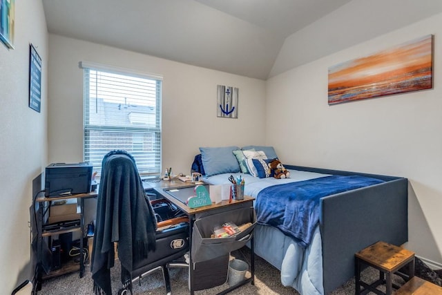 bedroom with carpet floors and vaulted ceiling