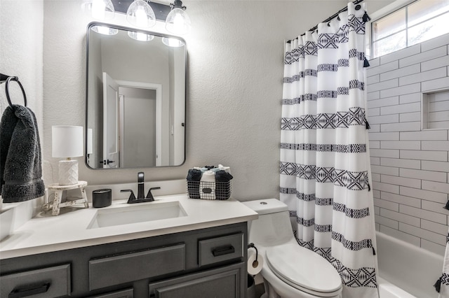 full bathroom with vanity, toilet, and shower / bath combo