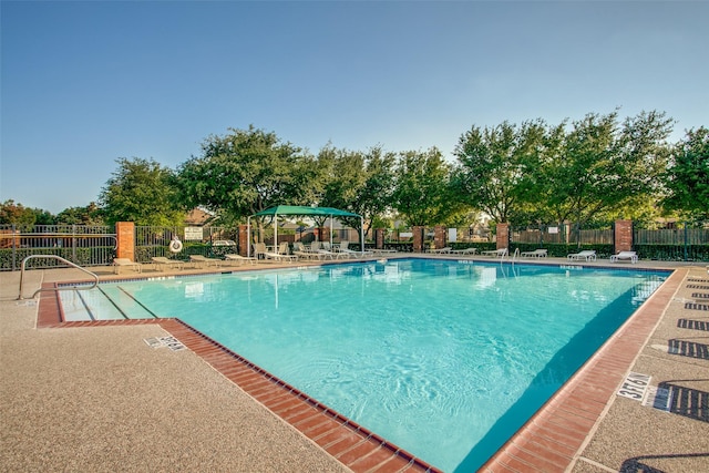 view of swimming pool featuring a gazebo and a patio area