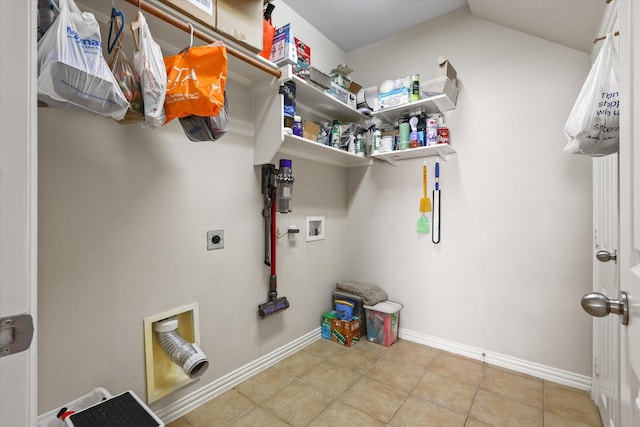 clothes washing area featuring washer hookup, light tile patterned floors, and electric dryer hookup