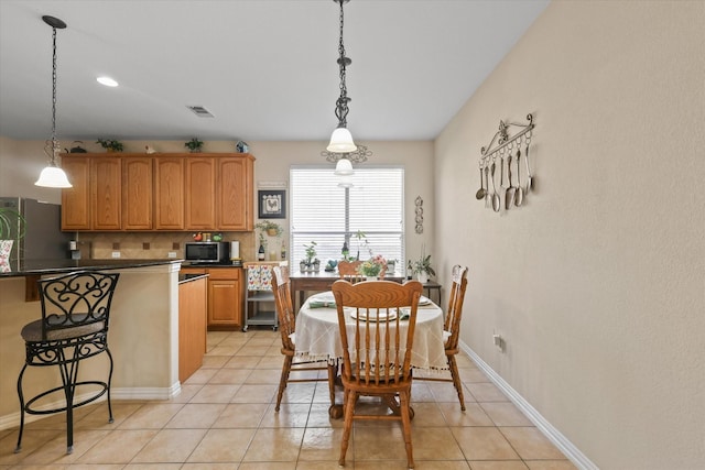 dining room with light tile patterned flooring