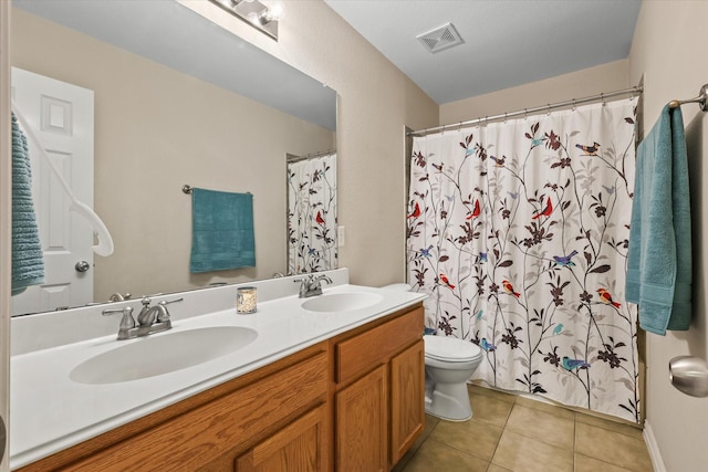 bathroom with a shower with curtain, vanity, toilet, and tile patterned flooring