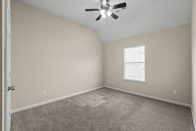 spare room with lofted ceiling, carpet, and ceiling fan