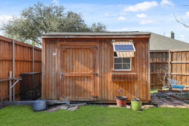 view of outbuilding featuring a yard