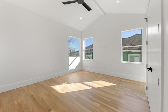 empty room with ceiling fan, beam ceiling, high vaulted ceiling, and light hardwood / wood-style flooring