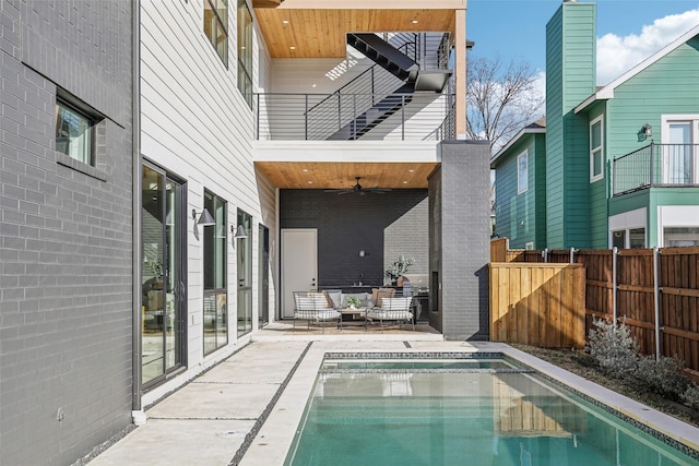 view of pool featuring ceiling fan, an outdoor hangout area, and a patio area