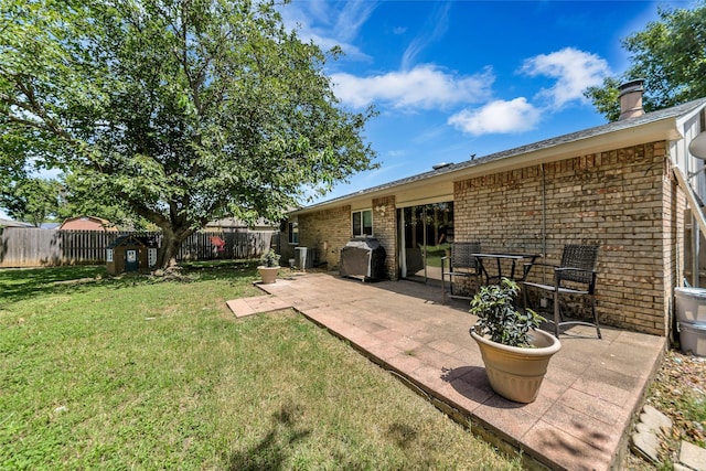 exterior space with a patio and central AC