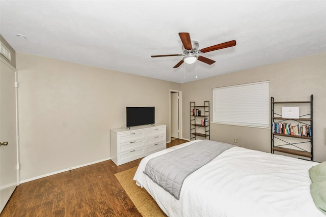 bedroom featuring ceiling fan and dark hardwood / wood-style flooring