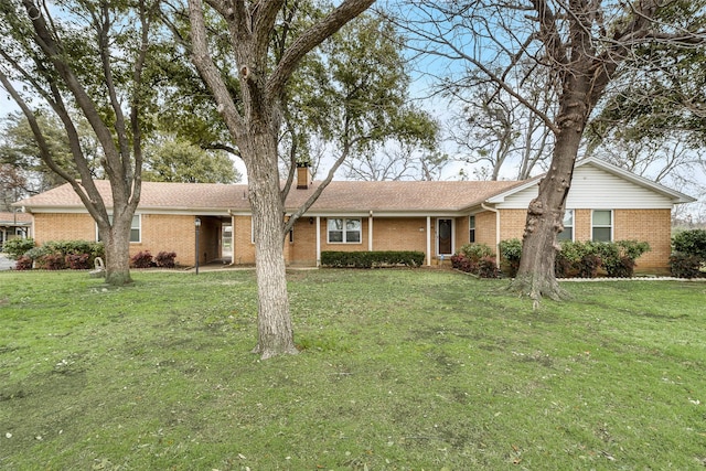 728 Del Dr, Denton, TX 76207 - ranch-style house featuring brick siding, a chimney, and a front lawn