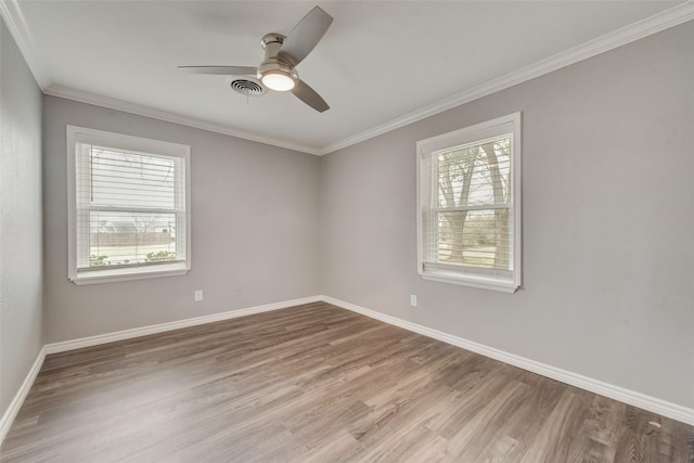 728 Del Dr, Denton, TX 76207 - empty room with wood finished floors, baseboards, a ceiling fan, and crown molding