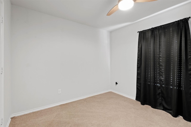 unfurnished bedroom with light carpet and ceiling fan