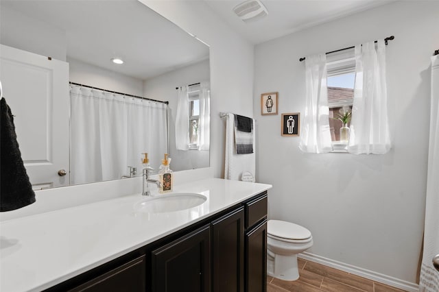 bathroom with vanity and toilet