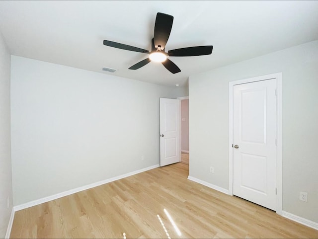 unfurnished bedroom with ceiling fan and light hardwood / wood-style floors