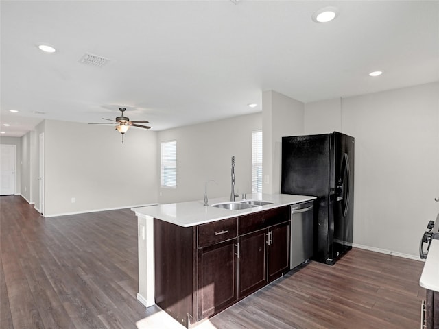 kitchen with dishwasher, sink, dark wood-type flooring, ceiling fan, and dark brown cabinets