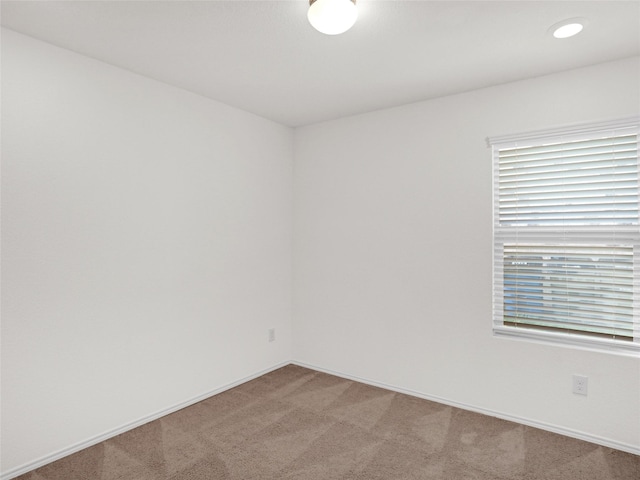 empty room with carpet flooring