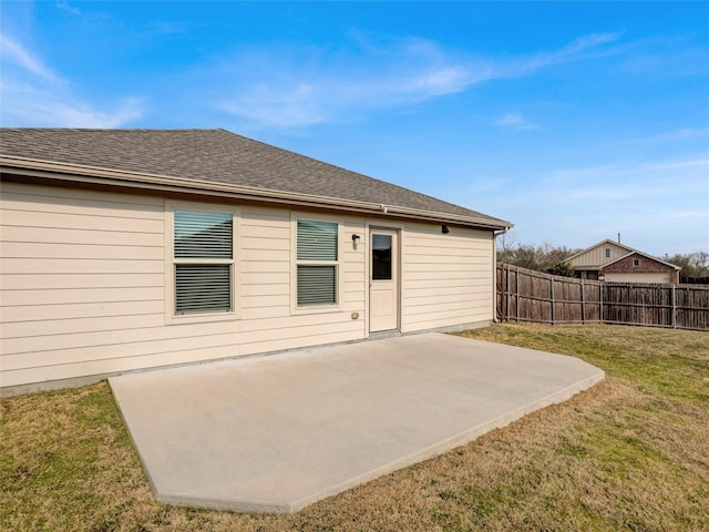 back of house featuring a yard and a patio area