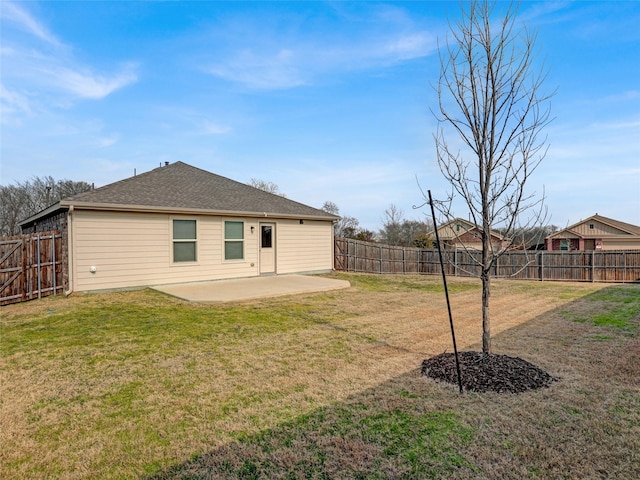 rear view of property with a patio and a yard