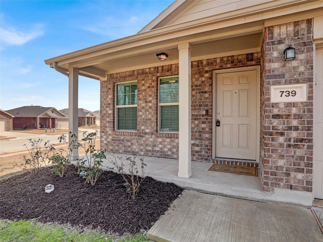 property entrance featuring covered porch