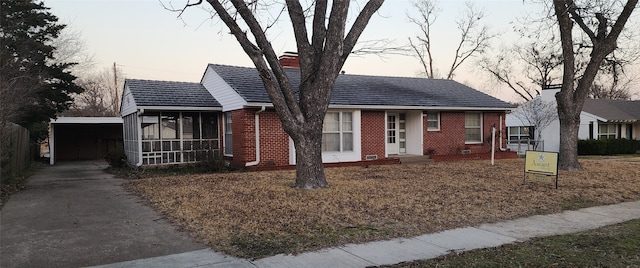 view of front of property featuring a carport