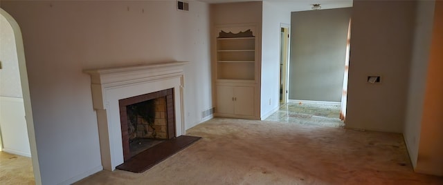 unfurnished living room with light colored carpet