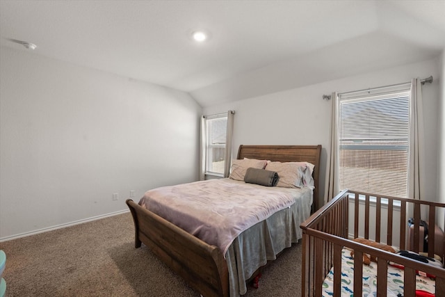 carpeted bedroom featuring lofted ceiling