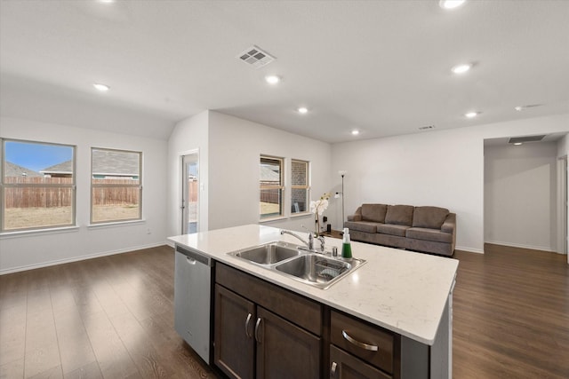 kitchen featuring stainless steel dishwasher, dark hardwood / wood-style flooring, sink, and a center island with sink