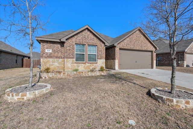 ranch-style house featuring a garage and a front lawn