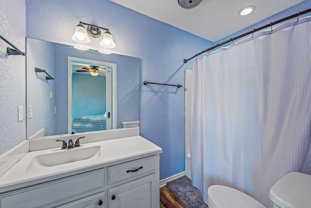 full bathroom with vanity, toilet, wood-type flooring, and shower / bath combo