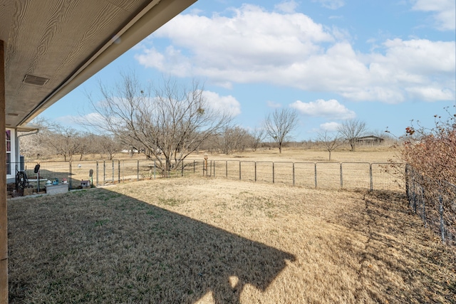 view of yard with a rural view