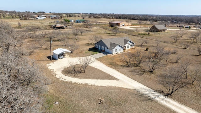 birds eye view of property featuring a rural view