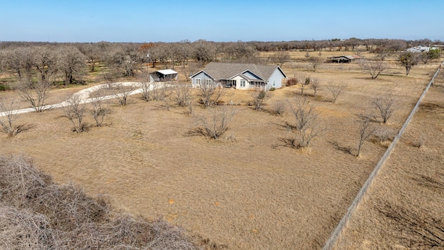 birds eye view of property featuring a rural view