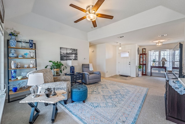 carpeted living room with ceiling fan